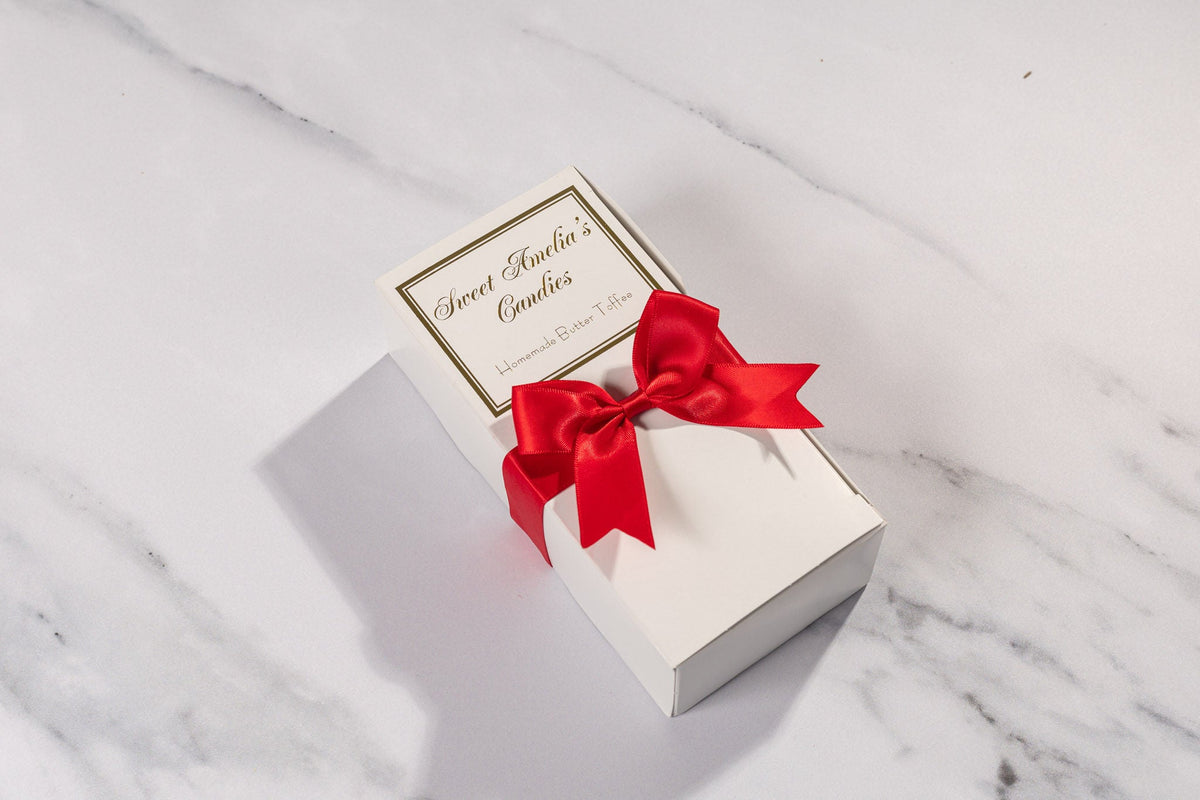 Sweet Amelia's 1/2 lb toffee box with red satin bow