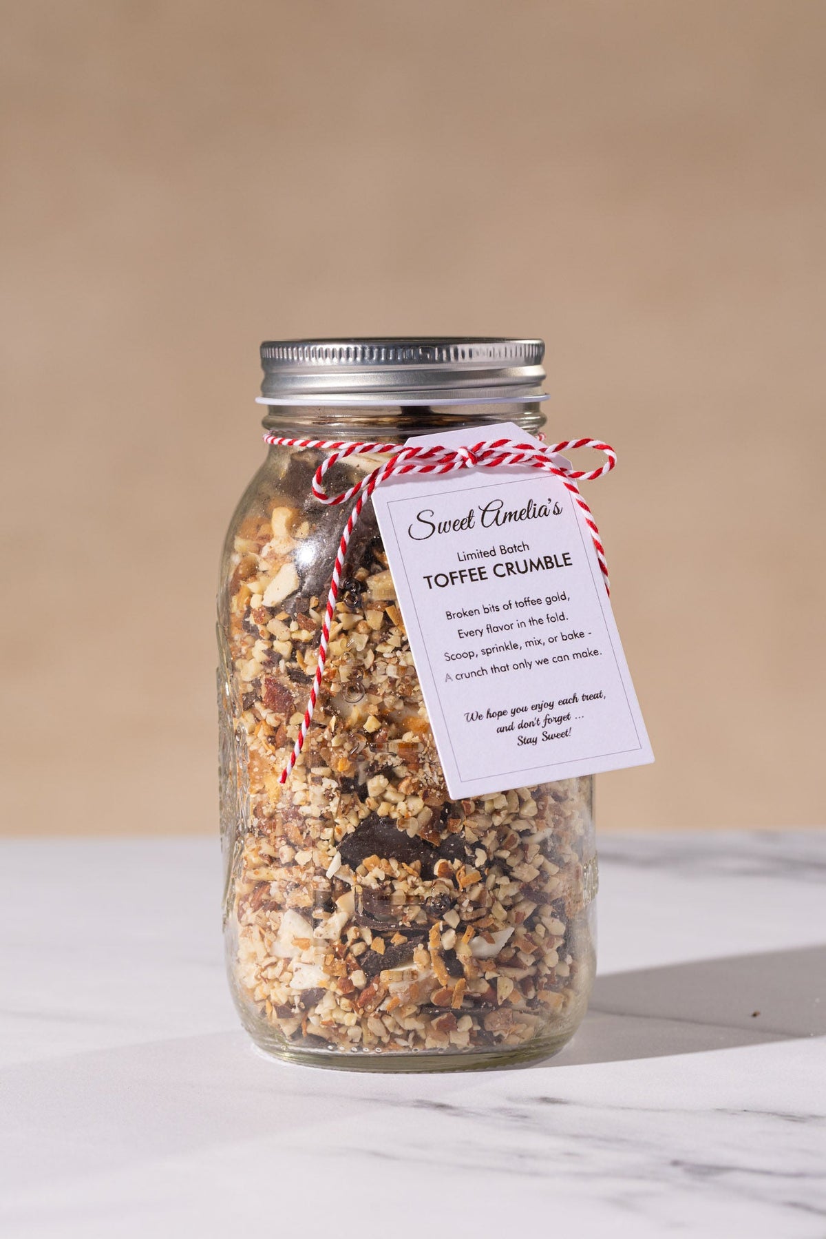 Large glass jar of Sweet Amelia's toffee crumble